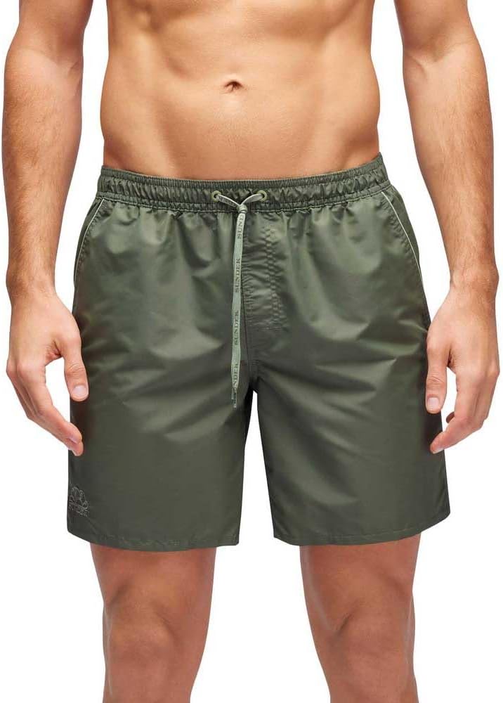 Pavo Monitor Arm mounted on a wooden office desk